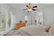 Bedroom featuring carpet, ceiling fan, and access to a private patio area at 3822 Marquise Ln, Mulberry, FL 33860