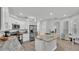Bright kitchen featuring a large island with granite countertops and stainless steel appliances at 3822 Marquise Ln, Mulberry, FL 33860