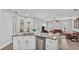 Open-concept kitchen and living area featuring a kitchen island with granite countertops at 3822 Marquise Ln, Mulberry, FL 33860