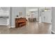 Open-concept layout with wood-look tile flooring, connecting living room to dining area at 3822 Marquise Ln, Mulberry, FL 33860