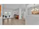Open-concept living area with wood-look tile and access to the outdoor pool area at 3822 Marquise Ln, Mulberry, FL 33860