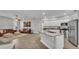 Open-concept living room with hardwood floors, neutral colors, and open access to the kitchen at 3822 Marquise Ln, Mulberry, FL 33860