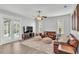 Bright living room with tile floors, comfortable sofas, and pool views at 3822 Marquise Ln, Mulberry, FL 33860