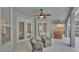 Inviting screened patio with ceiling fans, comfortable seating, and access to the outdoors at 3822 Marquise Ln, Mulberry, FL 33860