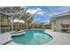 Private screened pool and spa surrounded by lush landscaping, perfect for relaxation and entertainment at 3822 Marquise Ln, Mulberry, FL 33860