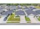Aerial view showcases new suburban homes with manicured lawns and coordinated landscaping at 3946 Willow Ridge Dr, Lakeland, FL 33810