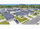 Aerial view showing homes with well-kept lawns, driveways, and mature landscaping at 3946 Willow Ridge Dr, Lakeland, FL 33810