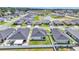 Aerial view highlighting the backyard with white fence of well-maintained homes in a suburban neighborhood at 3946 Willow Ridge Dr, Lakeland, FL 33810