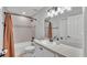 Bathroom with a single vanity, combination shower/tub, and a large mirror at 3946 Willow Ridge Dr, Lakeland, FL 33810