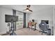 A bedroom featuring a Peloton and workspace at 3946 Willow Ridge Dr, Lakeland, FL 33810