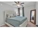 This bedroom features a queen bed, mirror and window at 3946 Willow Ridge Dr, Lakeland, FL 33810
