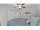 This bedroom has a closet, ceiling fan, and carpet flooring at 3946 Willow Ridge Dr, Lakeland, FL 33810