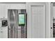 Close-up of the kitchen's stainless-steel refrigerator with a tablet display at 3946 Willow Ridge Dr, Lakeland, FL 33810