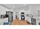 Well-lit kitchen with stainless steel appliances, wood floors, and white cabinets at 3946 Willow Ridge Dr, Lakeland, FL 33810