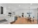 Open kitchen and dining area with stainless appliances and wood flooring at 3946 Willow Ridge Dr, Lakeland, FL 33810