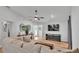 Spacious living room with modern ceiling fan, decor, and front door access at 3946 Willow Ridge Dr, Lakeland, FL 33810