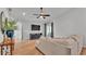 Bright and open living room featuring hardwood floors, a modern ceiling fan, and stylish decor at 3946 Willow Ridge Dr, Lakeland, FL 33810