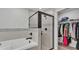 The main bathroom features a soaking tub, tiled walls, and a glass-enclosed shower at 3946 Willow Ridge Dr, Lakeland, FL 33810