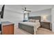Comfortable bedroom with ceiling fan, television, and two side tables at 3946 Willow Ridge Dr, Lakeland, FL 33810