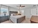 Comfortable bedroom with ceiling fan, side table, and ensuite bathroom at 3946 Willow Ridge Dr, Lakeland, FL 33810