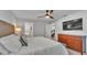 A spacious main bedroom featuring a ceiling fan, dresser, and entry to the bathroom at 3946 Willow Ridge Dr, Lakeland, FL 33810