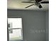 Bedroom with ceiling fan, window, and neutral walls at 4038 Oak Loop # 103, Mulberry, FL 33860