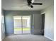 Bedroom featuring sliding glass doors leading to outdoor patio at 4038 Oak Loop # 103, Mulberry, FL 33860