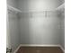 Walk-in closet with shelving and carpeted floor at 4038 Oak Loop # 103, Mulberry, FL 33860