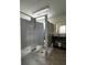 A community restroom featuring tiled flooring, stalls, and a vanity area at 4038 Oak Loop # 103, Mulberry, FL 33860