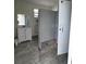 Community restroom featuring tiled floors and a utilitarian vanity and mirror at 4038 Oak Loop # 103, Mulberry, FL 33860