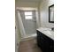 Modern bathroom with a granite vanity and tiled shower at 4127 Grove Pl, Lakeland, FL 33810