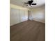 Bedroom showcasing a ceiling fan, closet, and light-colored walls at 4127 Grove Pl, Lakeland, FL 33810