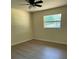 Bedroom featuring a ceiling fan and window with natural light at 4127 Grove Pl, Lakeland, FL 33810