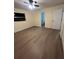 Comfortable bedroom with new flooring, neutral paint, and a window providing plenty of natural light at 4127 Grove Pl, Lakeland, FL 33810