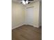 Bedroom with wood-look flooring and a closet for ample storage at 4127 Grove Pl, Lakeland, FL 33810