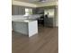 Well-equipped kitchen with gray cabinetry, stainless steel appliances, and a center island, perfect for cooking at 4127 Grove Pl, Lakeland, FL 33810