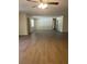 Bright, open-concept living room with modern flooring and neutral paint, perfect for entertaining and Gathering gatherings at 4127 Grove Pl, Lakeland, FL 33810