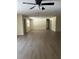 Bright, open-concept living room with modern flooring and neutral paint, perfect for entertaining and Gathering gatherings at 4127 Grove Pl, Lakeland, FL 33810
