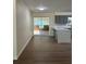 Bright living area leading to a kitchen with an island and a screened porch with lots of light at 4127 Grove Pl, Lakeland, FL 33810