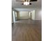 Bright, open-concept living room with modern flooring and neutral paint, perfect for entertaining and Gathering gatherings at 4127 Grove Pl, Lakeland, FL 33810