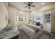 Cozy bedroom with built-in bookshelves, and a lovely view from the many windows at 4193 Stone Creek Loop, Lake Wales, FL 33859