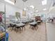 Bright and spacious classroom with tables, chairs, and natural light for various activities at 4193 Stone Creek Loop, Lake Wales, FL 33859