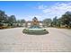 Community entrance featuring a central fountain and clear signage at 4193 Stone Creek Loop, Lake Wales, FL 33859