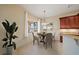 Bright breakfast nook featuring a wooden table, elegant chandelier, and view of the lanai at 4193 Stone Creek Loop, Lake Wales, FL 33859