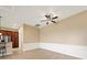 Dining area showcasing wainscoting detail, wood-look tile floors, and ample space for entertaining with seamless kitchen access at 4193 Stone Creek Loop, Lake Wales, FL 33859