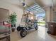 Bright garage featuring an electric golf cart and ample space for storage and parking at 4193 Stone Creek Loop, Lake Wales, FL 33859