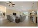 Spacious living room with tile flooring, ceiling fans, and expansive views of the outdoors at 4193 Stone Creek Loop, Lake Wales, FL 33859