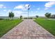 Scenic memorial site with brick-paved walkway, flag pole, and plaques honoring our troops at 4193 Stone Creek Loop, Lake Wales, FL 33859