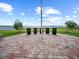 Scenic memorial site with brick-paved walkway, flag pole, and plaques honoring our troops at 4193 Stone Creek Loop, Lake Wales, FL 33859