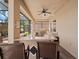 Covered outdoor kitchen with granite countertop bar, and stainless steel grill at 4193 Stone Creek Loop, Lake Wales, FL 33859